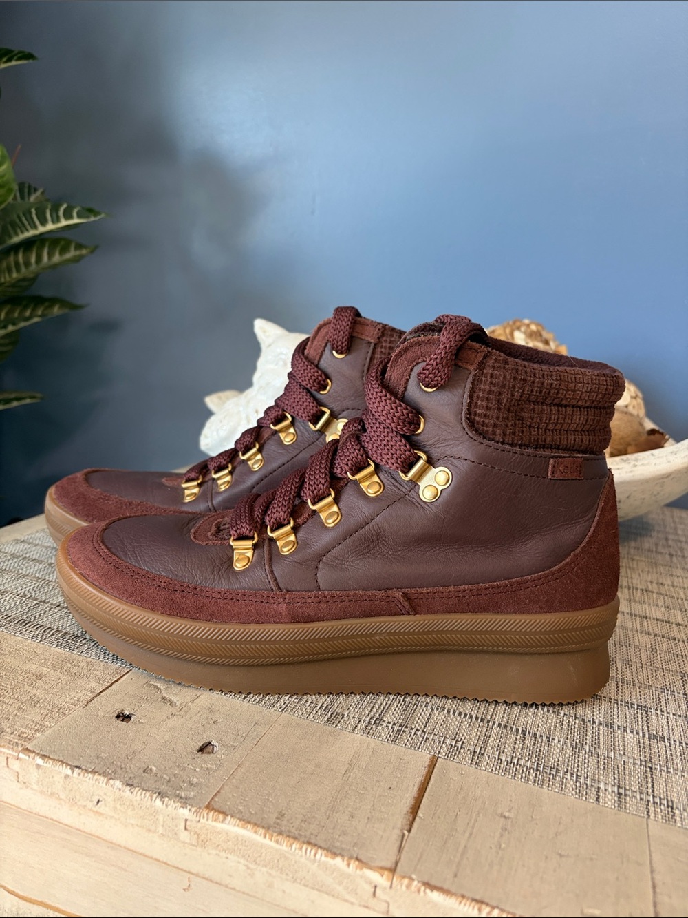 Women's Keds Burgundy High-Top Outdoor Water-Resistant Sneaker boots.